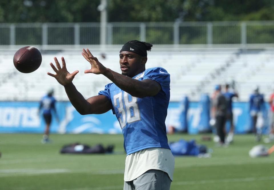 Lions running back Justin Jackson catches balls after training camp on Wednesday, July 26, 2023, in Allen Park.