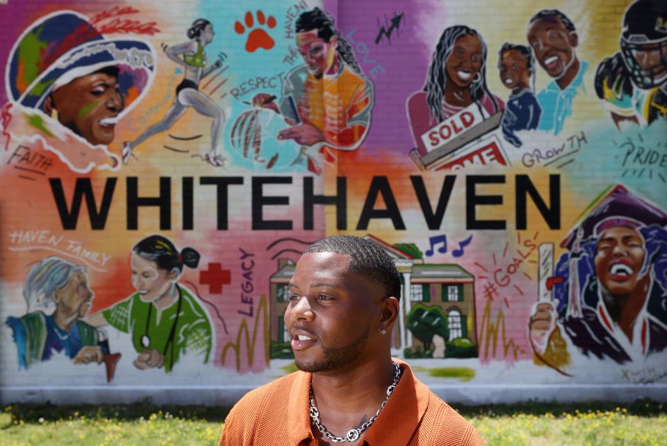 Local artist Tony Hawkins stands in front of his new mural on the wall of the Whitehaven Community Center, a collaboration with the UrbanArt Commission and the city of Memphis' Department of Comprehensive Planning, during its unveiling on Friday, June 3, 2022.