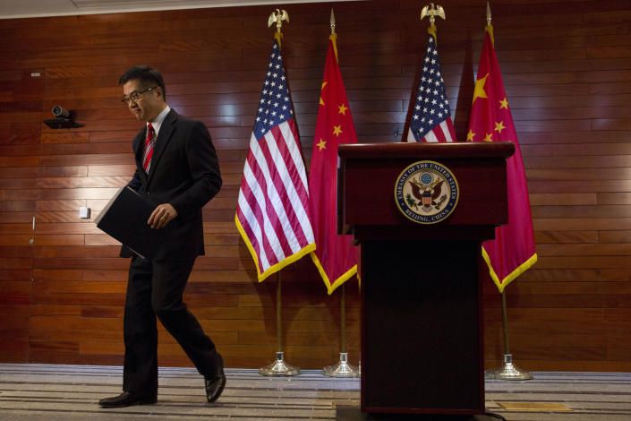 FILE - In this Thursday, Feb. 27, 2014, file photo, Gary Locke, the outgoing U.S. ambassador to China, leaves after a farewell news conference held at the U.S. Embassy in Beijing. A major Chinese government news service used a racist slur to describe Locke in a mean-spirited editorial on Friday that drew widespread public condemnation in China. (AP Photo/Ng Han Guan, Pool, File)