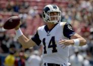 FILE PHOTO: Aug 18, 2018; Los Angeles, CA, USA; Los Angeles Rams quarterback Sean Mannion (14) looks to pass against the Oakland Raiders in the first quarter during a preseason game at Los Angeles Memorial Coliseum. Mandatory Credit: Kirby Lee-USA TODAY Sports