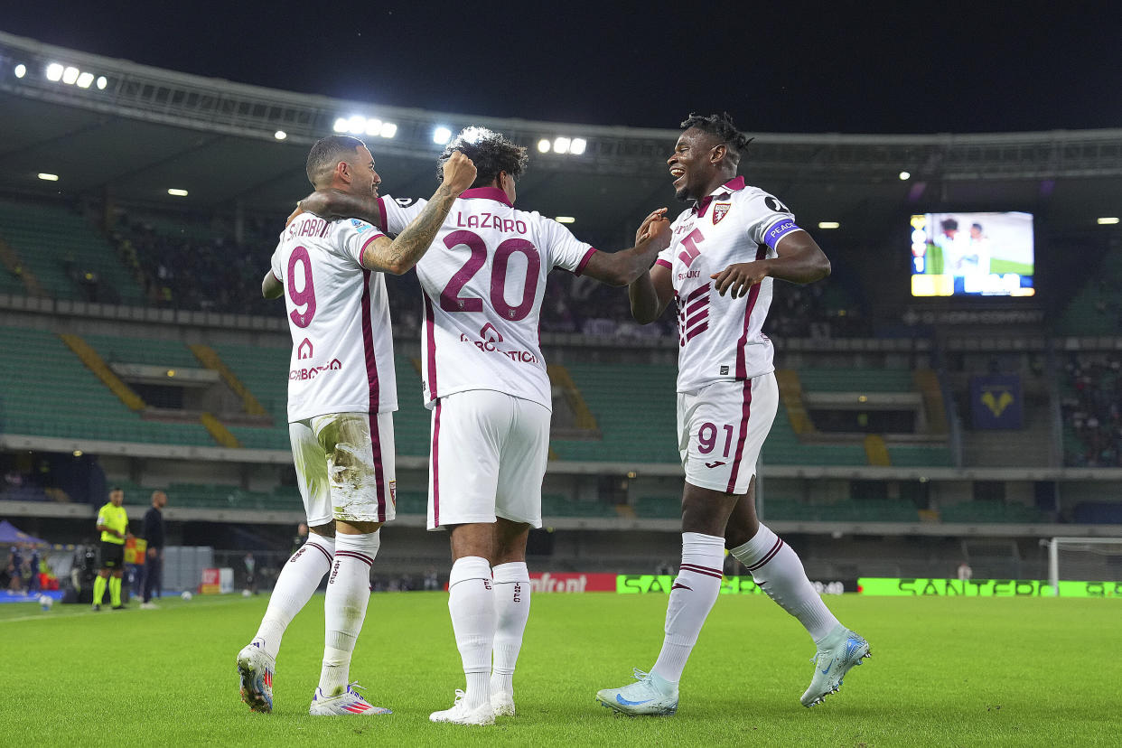 Torino's Antonio Sanabria, left, celebrates scoring with teammates during the Serie A soccer match between Hellas Verona and Torino at the Bentegodi Stadium in Verona, Italy, Friday Sept. 20, 2024. (Spada/LaPresse via AP)