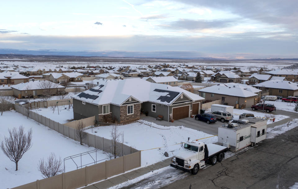 FILE - A home where eight people were found dead in Enoch, Utah, is pictured on Jan. 5, 2023. A Utah man who fatally shot his wife, her mother and their five kids before turning the gun on himself detailed his anger toward his wife in his suicide note, investigators wrote in a report released on Friday, April 7, 2023. (Ben B. Braun/The Deseret News via AP, File)