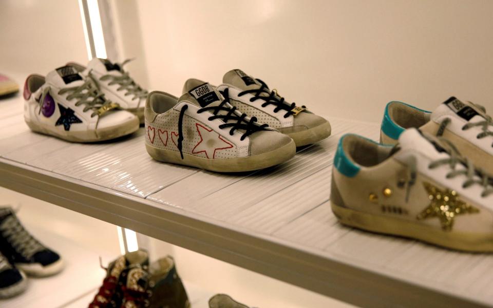 Trainers of Italian high fashion sneaker brand Golden Goose on display at a store in Beijing, 2020