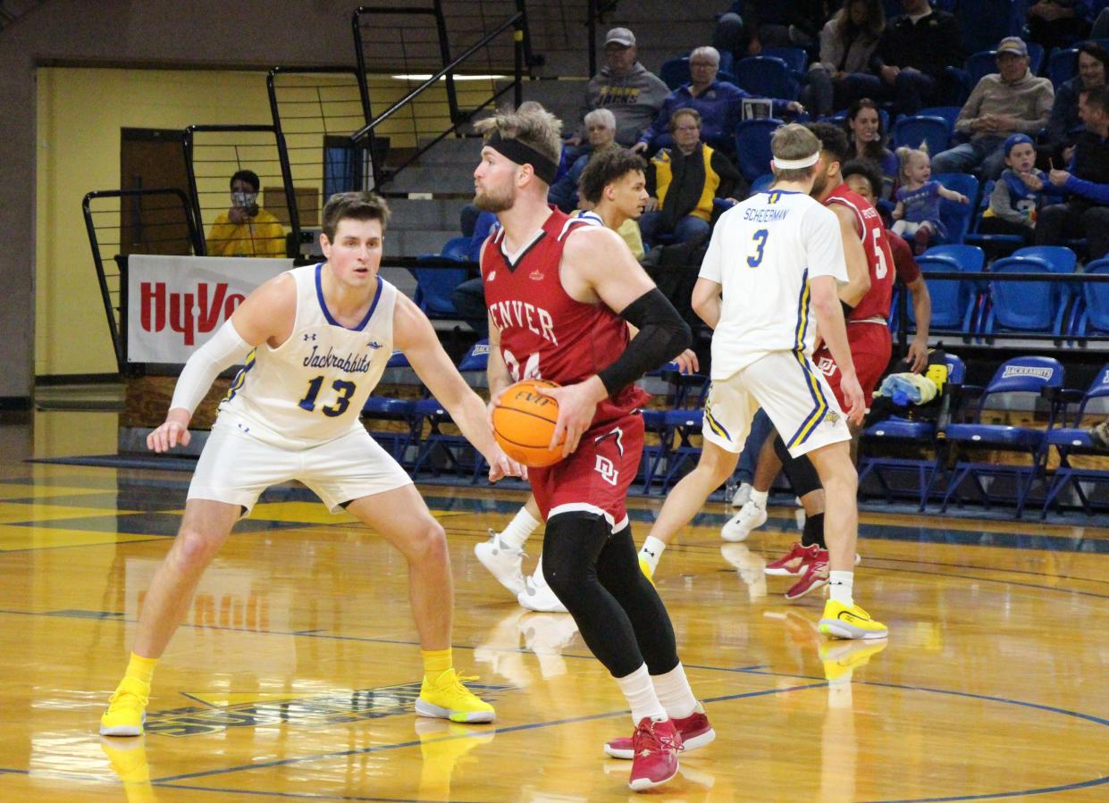 Denver's Michael Henn tries to work around the defense of SDSU's Luke Appel during Saturday's Summit League game at Frost Arena.