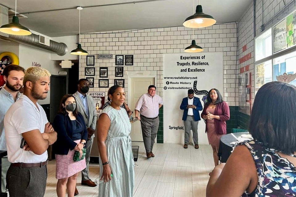 Gina Lathan, right, leads a Route History tour for Illinois Gov. J.B. Pritzker, Lt. Gov. Juliana Stratton, and staff from the Illinois Department of Commerce and Economic Opportunity. (Courtesy Gina Lathan)