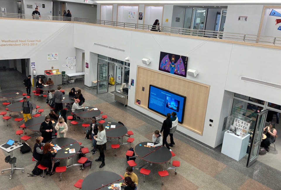 The Great Hall of the former museum gets good use at GRPMS. The Commons and design lab are located on the lower floor, with classroom flex space above. (Beth Fertig)