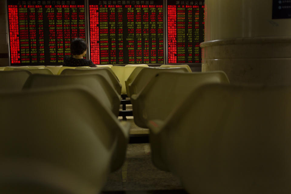 A Chinese investor monitors stock prices at a brokerage house in Beijing, Wednesday, Sept. 11, 2019. Asian shares were mostly higher Wednesday, cheered by a rise on Wall Street amid some signs of easing tensions between the U.S. and China on trade issues. (AP Photo/Mark Schiefelbein)