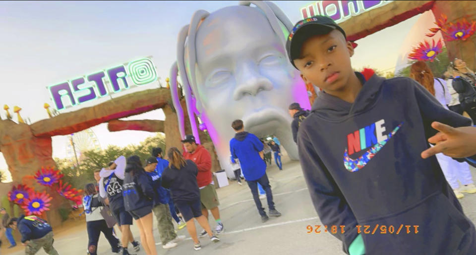 FILE - This photo provided by Taylor Blount shows Ezra Blount, 9, posing outside the Astroworld music festival in Houston on Nov. 5, 2021. Ezra is the youngest person to die from injuries sustained during a crowd surge at the Astroworld music festival. Several families of the 10 people who died from injuries in the crush of fans at the Astroworld festival, including the Blount family, have turned down an offer by headliner Travis Scott to pay for their loved ones’ funeral costs. (Courtesy of Taylor Blount via AP)