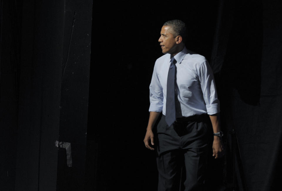 President Barack Obama walks on stage to speak at a fundraising event at the Austin Music Hall in Austin, Texas, Tuesday, July 17, 2012. Obama is spending the day fundraising in Texas. (AP Photo/Susan Walsh)