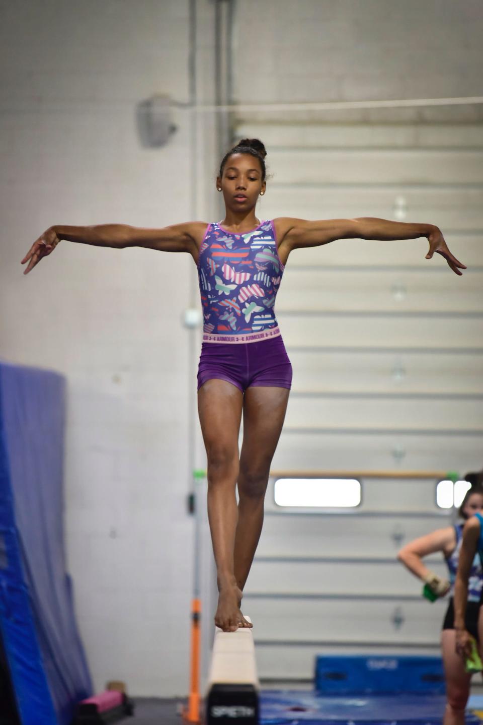 Olivia Kelly, a Mahwah resident who is an Olympic hopeful for Team Barbados, practices on the balance beam at North Stars Gymnastics Academy in Boonton Tuesday on 07/25/22.