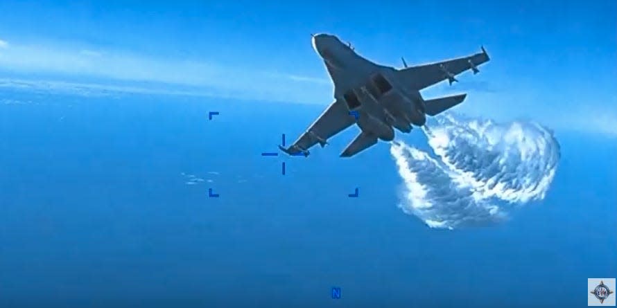 Russian Su-27 fighter jet intercepting a US MQ-9 Reaper drone over the Black Sea in footage released by the US military.