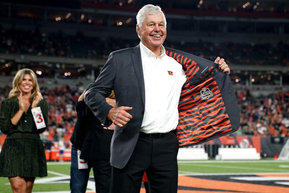 Former Cincinnati Bengals quarterback Ken Anderson displays the Ring of Honor insignia on the inside of his jacket during a halftime ceremony at halftime of a Week 4 NFL football game between the Jacksonville Jaguars and the Cincinnati Bengals, Thursday, Sept. 30, 2021, at Paul Brown Stadium in Cincinnati. 