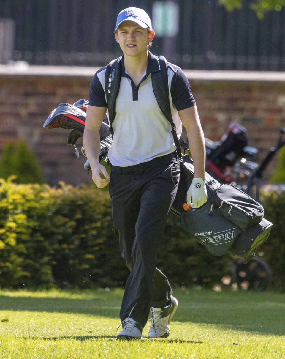 <p>Tom Holland hits the green for a round of golf with friends in London on Wednesday.</p>