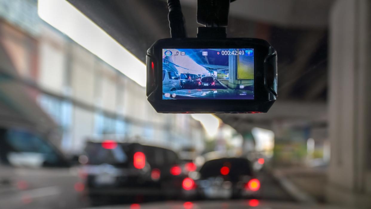 Dash Camera or car video recorder in vehicle on the way.