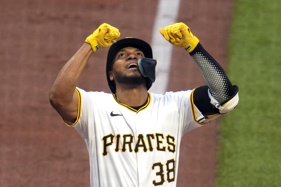 Pittsburgh Pirates' Edward Olivares celebrates as he crosses home plate after hitting a grand slam off Los Angeles Angels starting pitcher Tyler Anderson during the third inning of a baseball game in Pittsburgh, Monday, May 6, 2024. (AP Photo/Gene J. Puskar)