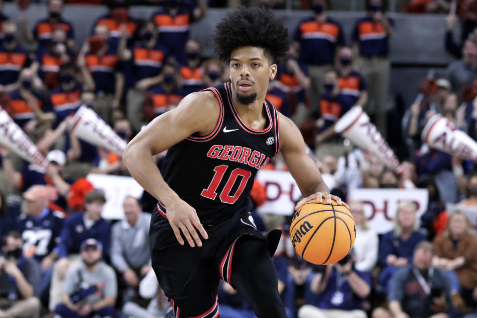 Georgia guard Aaron Cook brings the ball up during the first half of the team's NCAA college basketball game against Auburn on Wednesday, Jan. 19, 2022, in Auburn, Ala. (AP Photo/Butch Dill)