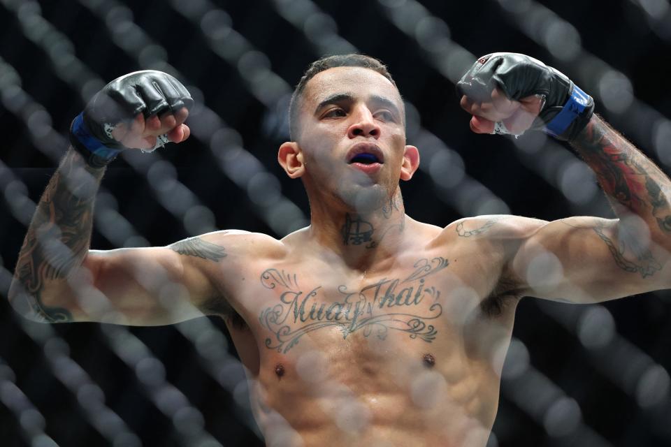 Brazil's Carlos Prates celebrates his win by knocking out China's Li Jingliang in their men's welterweight division event of the Ultimate Fighting Championship (UFC) 305 at the Perth Arena in Perth on August 18, 2024. (Photo by COLIN MURTY / AFP) / -- IMAGE RESTRICTED TO EDITORIAL USE - STRICTLY NO COMMERCIAL USE -- (Photo by COLIN MURTY/AFP via Getty Images)