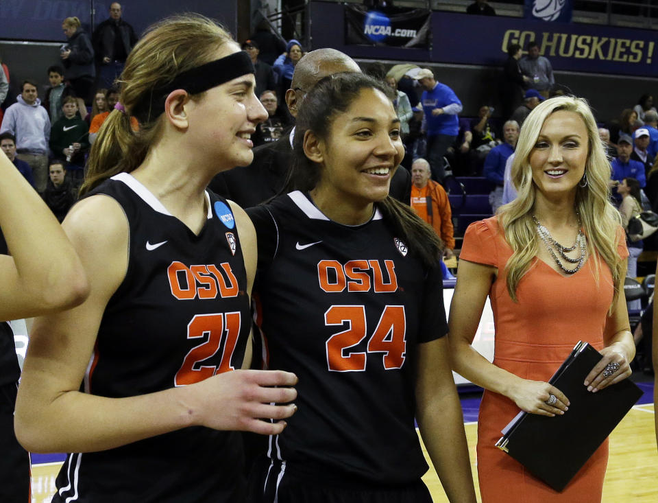 Oregon State's Sydney Wiese (21) and Alyssa Martin (24) walk off the court with assistant coach Mandy Close, right, after OSU beat Middle Tennessee State 55-36 in a first-round game in the NCAA women's college basketball tournament, Sunday, March 23, 2014, in Seattle. (AP Photo/Ted S. Warren)