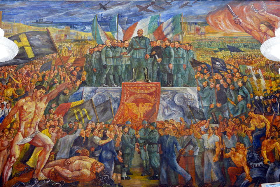 A detail of the mural titled "Apotheosis of Fascism", by Luigi Montanarini, believed to have been painted between the late1930's and early 1940's, in the Salone d'Onore of the CONI headquarters, in Rome, Tuesday, May 14, 2019. While Germany systematically wiped out traces of Adolf Hitler’s Nazi regime after World War II, the legacy of his Axis ally, Benito Mussolini, remains present in Italy even today. (AP Photo/Andrew Medichini)