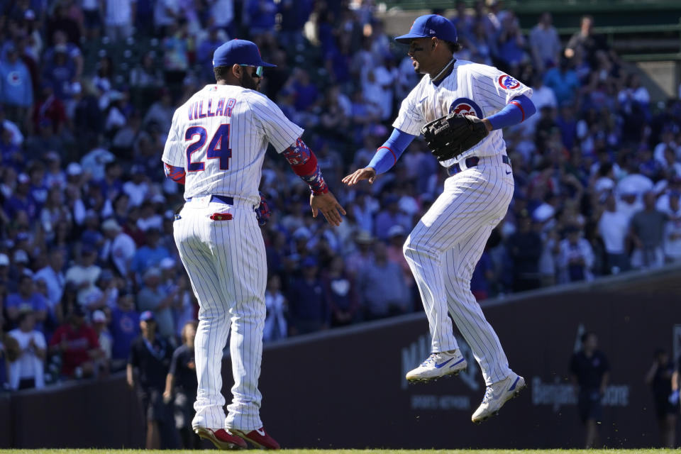 Chicago Cubs' Jonathan Villar, left, celebrates with Christopher Morel after they defeated the Atlanta Braves in a baseball game in Chicago, Saturday, June 18, 2022. (AP Photo/Nam Y. Huh)
