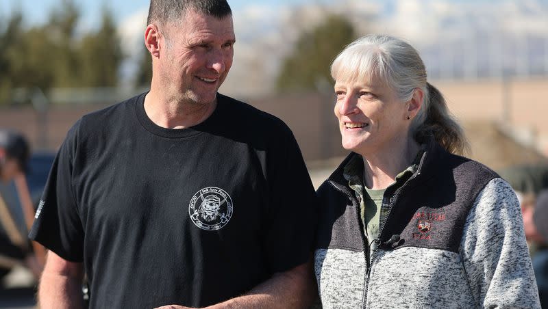 Volunteer Michael and Jayel Kirby talk about assisting in filling sandbags in Midvale on Friday, March 17, 2023, as part of a two-day plan of action preparing for the spring runoff. The Kirbys first met years ago while filling sandbags at the same location and were later married.