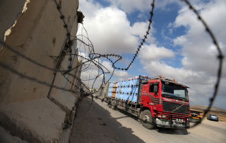 A truck carrying goods arrives at Kerem Shalom crossing in Rafah in the southern Gaza Strip August 15, 2018. REUTERS/Ibraheem Abu Mustafa