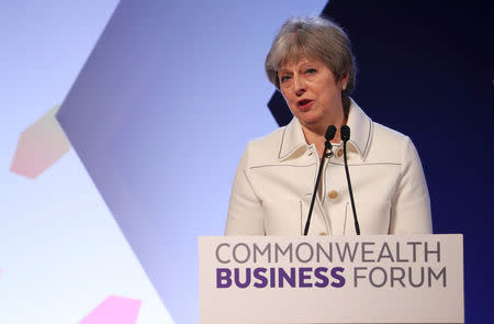 Britain's Prime Minister Theresa May speaks at a Commonwealth Heads of Government Meeting business forum in London, April 16, 2018. REUTERS/Hannah McKay