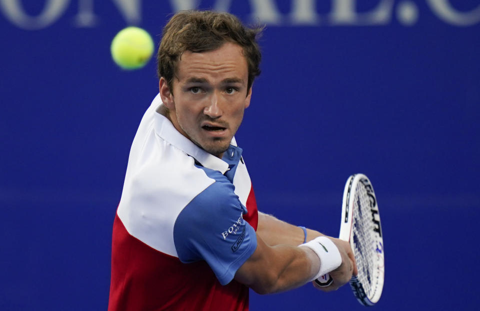 Daniil Medvedev of Russia returns a ball during a match against to Benoit Paire of France at the Mexican Open tennis tournament in Acapulco, Mexico, Tuesday, Feb. 22, 2022. (AP Photo/Eduardo Verdugo)