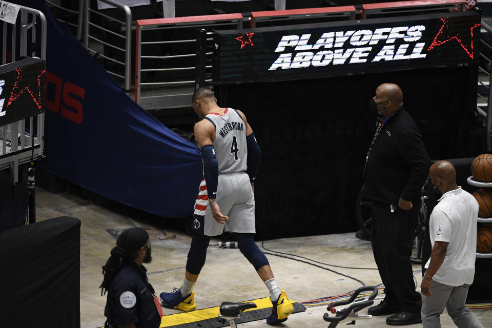 Washington Wizards guard Russell Westbrook (4) walks toward the tunnel during the second half of Game 3 in a first-round NBA basketball playoff series against the Philadelphia 76ers, Saturday, May 29, 2021, in Washington. (AP Photo/Nick Wass)