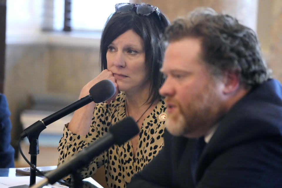 Mississippi House Medicaid Committee Chairperson Missy McGee, R-Hattiesburg, left, listens as Drew Snyder, executive director of the Mississippi Division of Medicaid, gives members of the committee an outline of the state's Medicaid program at the Mississippi Capitol, Wednesday, Feb. 7, 2024, in Jackson, Miss. (AP Photo/Rogelio V. Solis)