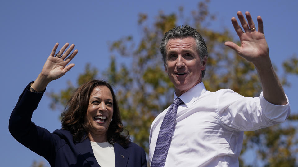 Vice President Kamala Harris stands on stage with California Gov. Gavin Newsom at the conclusion of a campaign event at the IBEW-NECA Joint Apprenticeship Training Center in San Leandro, Calif., Wednesday, Sept. 8, 2021. (AP Photo/Carolyn Kaster)