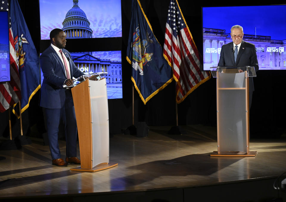 Senate Majority Leader Chuck Schumer, D-N.Y., right, participates in a debate against Republican challenger Joseph Pinion, hosted by Spectrum News 1, Sunday, Oct. 30, 2022, at Union College in Schenectady, N.Y. (AP Photo/Hans Pennink, Pool)