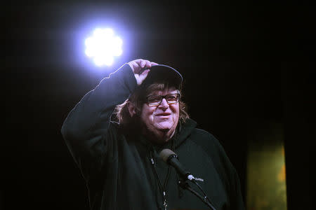 Michael Moore speaks at a protest against U.S. President-elect Donald Trump outside the Trump International Hotel in New York City, U.S. January 19, 2017. REUTERS/Stephanie Keith