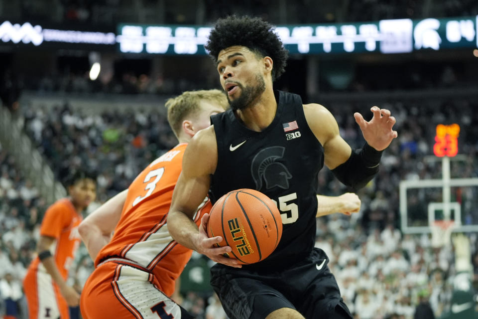 Michigan State forward Malik Hall (25) is defended by Illinois forward Marcus Domask (3) during the second half of an NCAA college basketball game, Saturday, Feb. 10, 2024, in East Lansing, Mich. (AP Photo/Carlos Osorio)