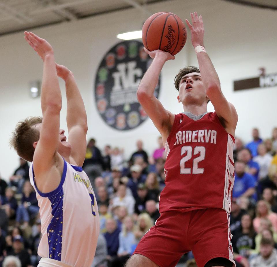 Minerva's Garrett Gonzalez (22) puts up a shot defended by Maysville's Wesley Armstead during a district semifinal, Wednesday, March 6, 2024, at Claymont High School.
