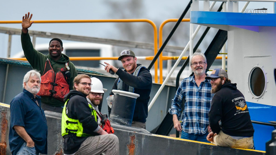 <em>Employees of Norfolk-based Seaward Marine pose for a picture while responding to the Francis Scott Key Bridge salvage operation (Courtesy: Mark Hergan / Deadrise Marine Photography)</em>
