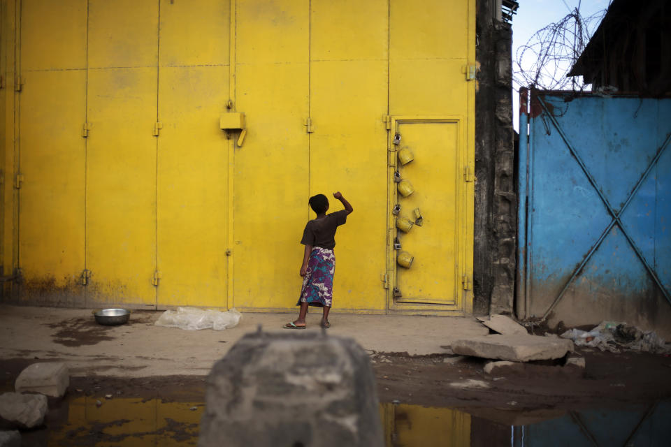 FILE - A child plays in the streets of Monrovia, Liberia, Sept. 28, 2014. Liberia is celebrating two major anniversaries this year — 200 years ago freed slaves from the U.S. arrived here and 25 years later they declared the country to be independent. Amid the festivities for Independence Day on Tuesday July 26, 2022, many Liberians say the West African country's promise is unfulfilled and too many of its people still live in poverty. (AP Photo/Jerome Delay, File)