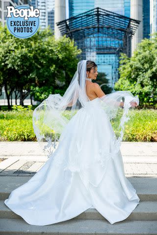 <p>Neringa Plank NeriPhoto</p> Madelyn Iacurci in a Valentini gown in Chicago on her July 8, 2023 wedding day.