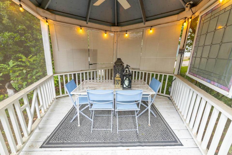 The backyard has plenty of space for seating and a gazebo for outdoor dining.