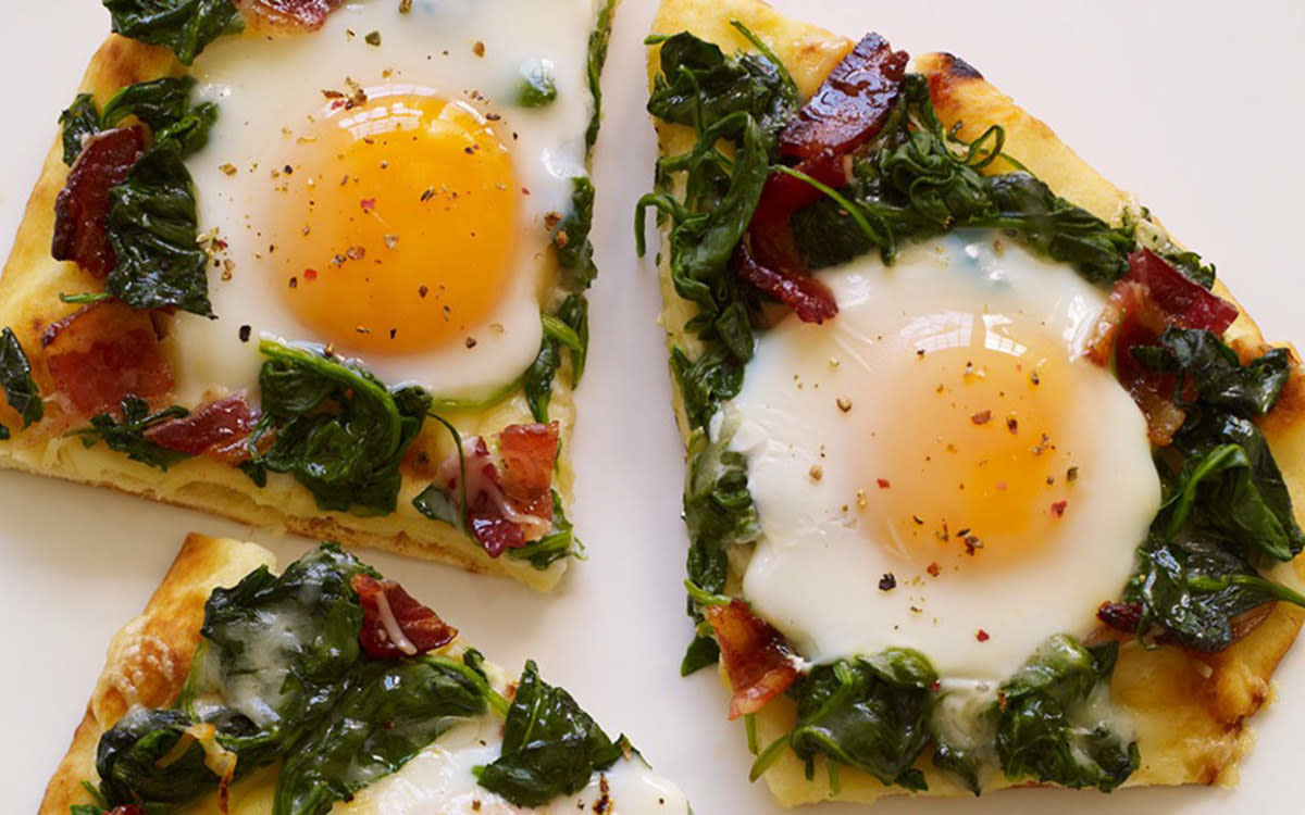 <p>McCormick Gourmet</p><p> This upscale breakfast pizza features a naan flatbread crust, candied bacon, spinach, Gruyere cheese and sunny-side up eggs.</p><p><strong>Get the recipe: <a href="https://www.mccormick.com/gourmet/recipes/breakfast-brunch/applewood-bacon-and-eggs-breakfast-flatbread" rel="nofollow noopener" target="_blank" data-ylk="slk:Applewood Bacon and Eggs Breakfast Flatbread;elm:context_link;itc:0;sec:content-canvas" class="link rapid-noclick-resp">Applewood Bacon and Eggs Breakfast Flatbread</a></strong></p>