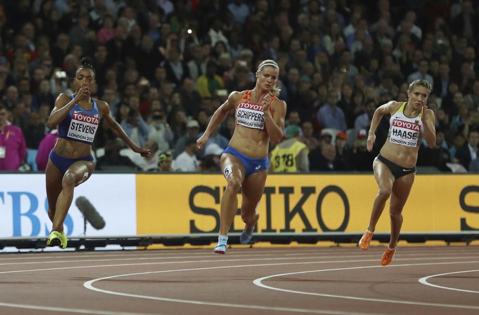 United States’ Deajah Stevens, Netherlands’ Dafne Schippers and Germany’s Rebekka Haase, from left, compete in a women’s 200-meter semifinal during the World Athletics Championships in London Thursday, Aug. 10, 2017. (AP Photo/Leonore Schick)