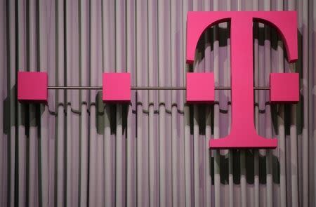 The logo of German company Deutsche Telekom is pictured at the CeBit computer fair in this file photo taken in Hanover, March, 6, 2012. REUTERS/Fabian Bimmer/Files