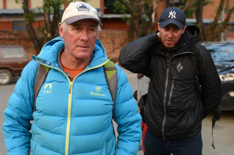 New Zealand mountaineer and Mount Everest expedition organiser Russell Brice (L) and British mountaineer and expedition leader Phil Crampton arrive in Kathmandu to speak with the Nepalese Government, at Kathmandu Airport on April 22, 2014