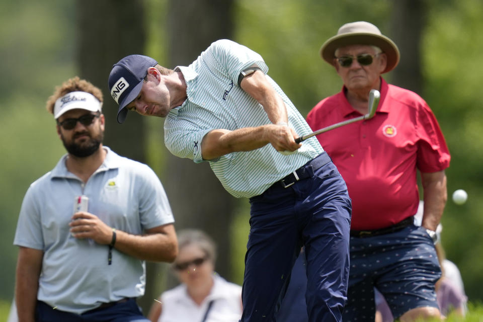 Alex Smalley hits out of the rough on the 17th hole during the third round of the John Deere Classic golf tournament, Saturday, July 8, 2023, at TPC Deere Run in Silvis, Ill. (AP Photo/Charlie Neibergall)