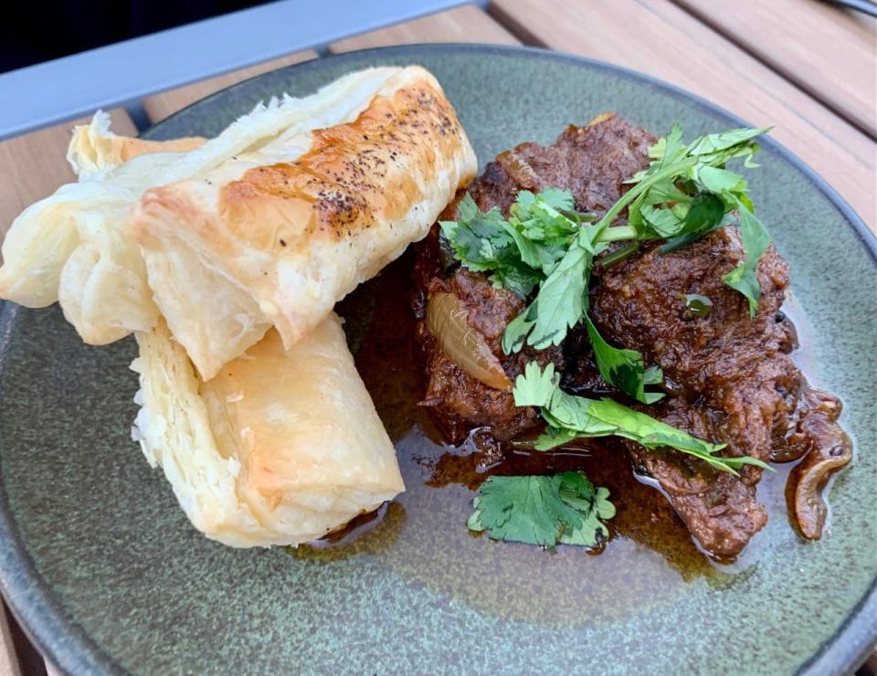 Generously seasoned spicy beef chunks, accompanied by an airy puff pastry, made the kerala beef puff dish at Mesa a favorite.