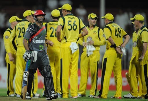 Afghanistan's Asghar Stanikzai (L) leaves the ground after being dismissed during their ODI against Australia on August 26. Cricket has progressed by leaps and bounds in the last three years after it was introduced by youths who learnt the game in refugee camps in Pakistan