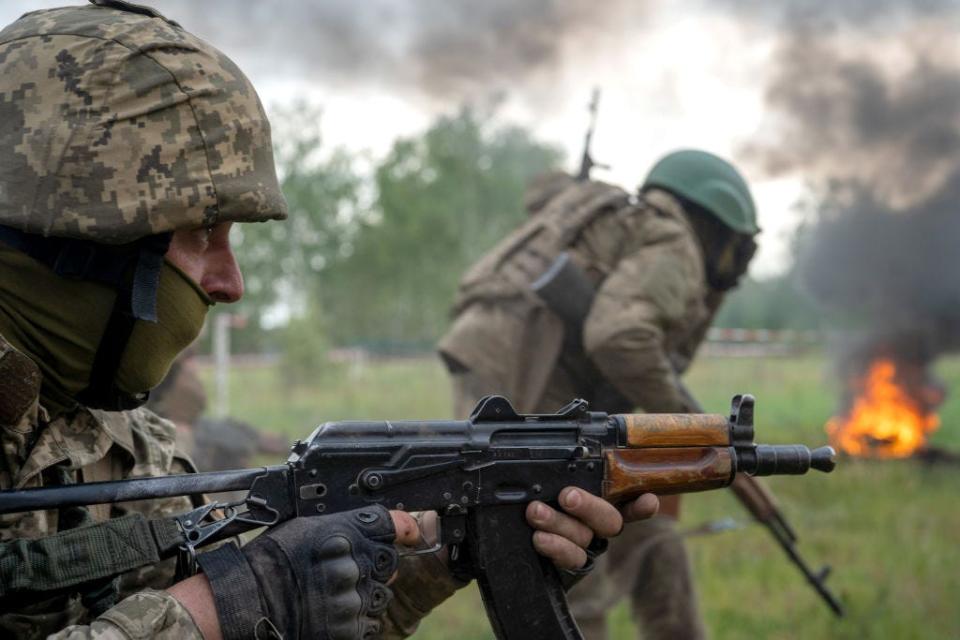 A soldier aims a rifle during a military drill headed by Commander of the Joint Forces of the Armed Forces of Ukraine, Lieutenant-General Serhii Naiev in the Northern Operational Zone, Kyiv Region, northern Ukraine.