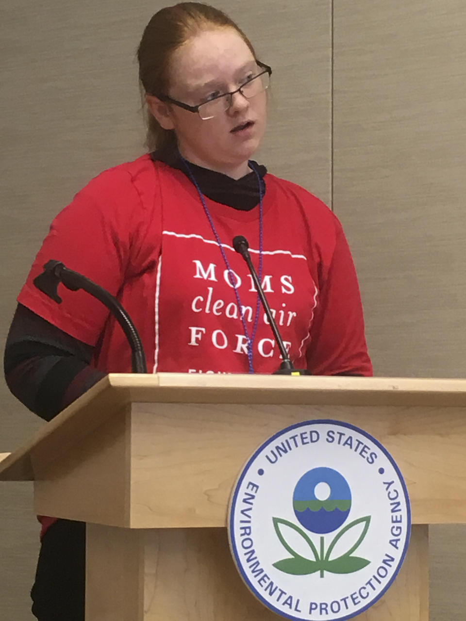 Alexis Elliott, 13, speaks at a U.S. Environmental Protection Agency hearing in Denver on Wednesday, Nov. 14, 2018, on methane. Elliott said emissions from oil and gas wells near her school are causing her serious health problems and told agency officials, "Polluters do not need your protection. I do." The hearing was to take public comment on the EPA's proposal to roll back Obama-era rules requiring energy companies to step up the detection and elimination of methane leaks at their facilities. Methane is the primary component of natural gas and is also a greenhouse gas. (AP Photo/Dan Elliott)