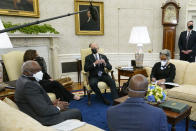 President Joe Biden speaks as he and Vice President Kamala Harris meet with members of the Congressional Black Caucus in the Oval Office of the White House, Tuesday, April 13, 2021, in Washington. Sitting are House Majority Whip James Clyburn, of S.C., from left, Sen. Raphael Warnock, D-Ga., and Rep. Joyce Beatty, D-Ohio. (AP Photo/Patrick Semansky)