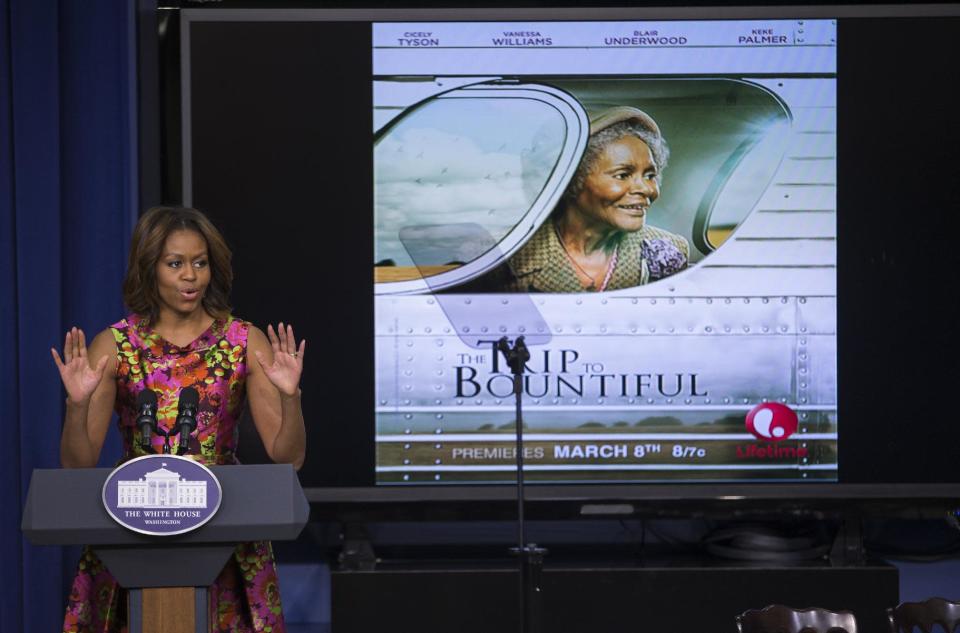 First lady Michelle Obama gestures during remarks after a screening of the movie "The Trip to Bountiful" in the South Court Auditorium on the White House complex on Monday, Feb. 24, 2014, in Washington. (AP Photo/ Evan Vucci)